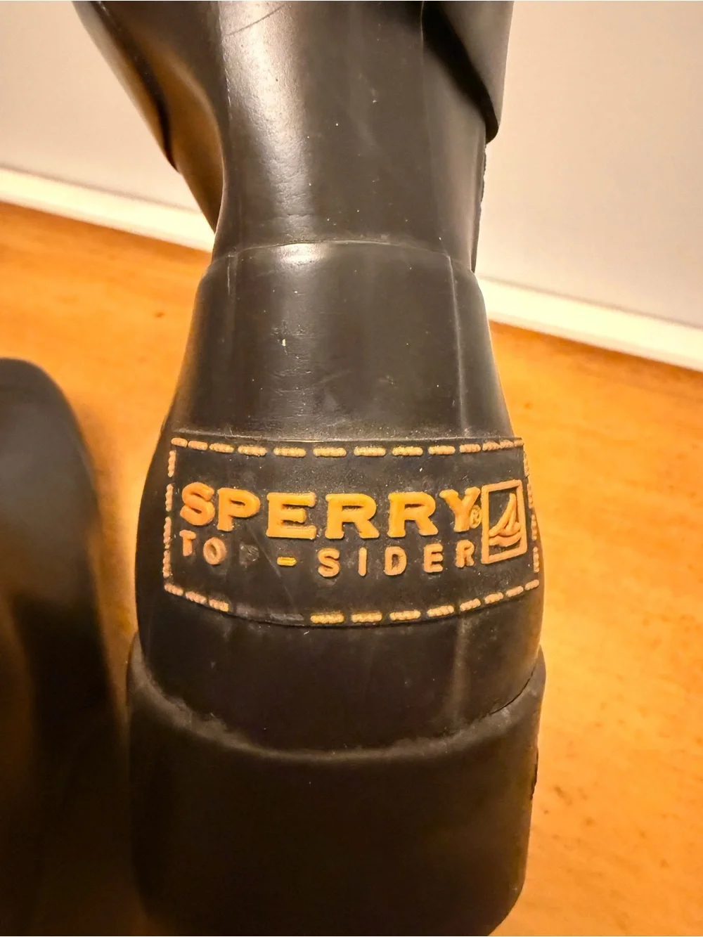 Sperry Black Ankle Rain Boots with Orange Logo Accent